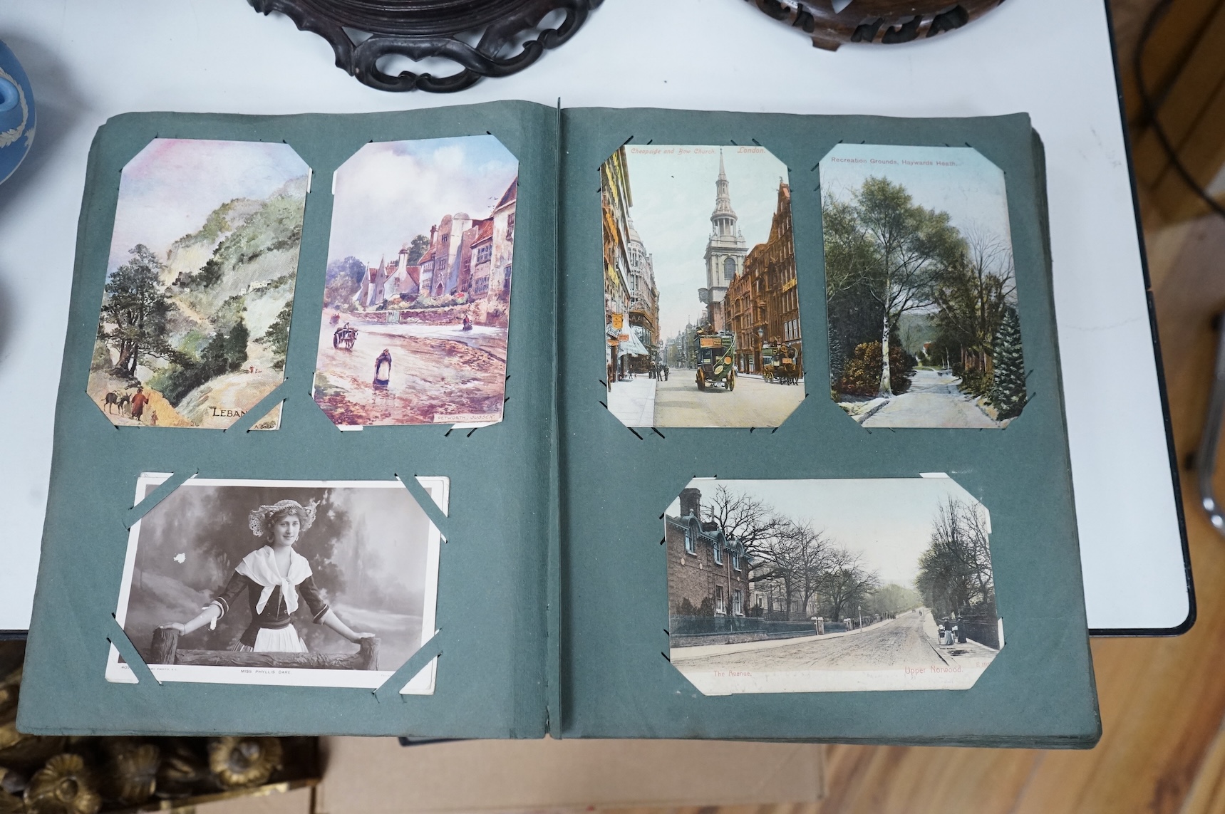 A postcard album to include greetings cards and topographical examples